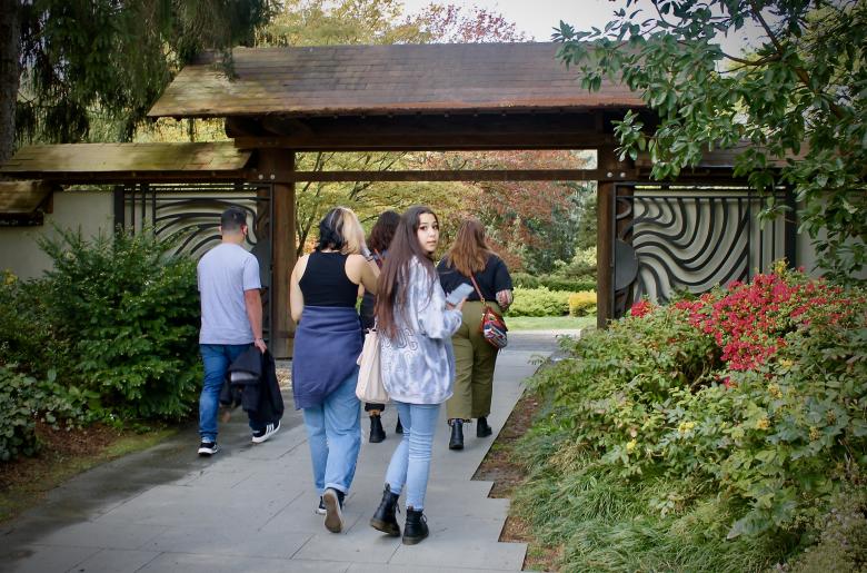 Humanities 103 students enter the Japanese Garden in Seattle's Arboretum