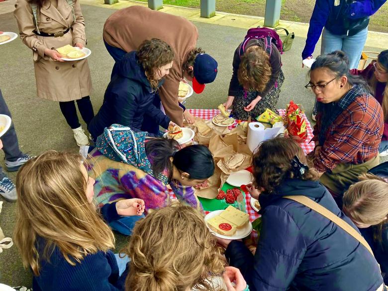 Humanities 103 Students enjoy a picnic lunch on a field trip to the Duwamish Waterway Park