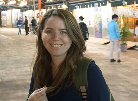 Maggie Le smiling in a Japanese shopping center