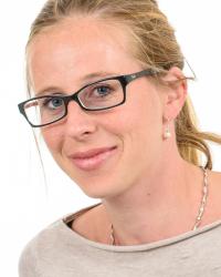 Professor Ferjan Ramirez smiling in front of a white background