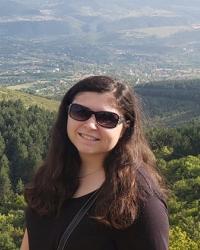 Taylor Eftimov smiling wearing sunglasses outdoors